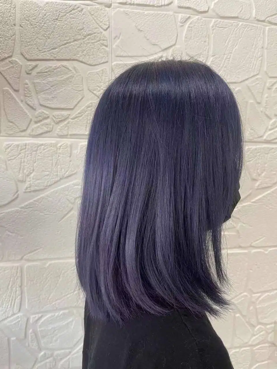 Bonbon Blowout Bar+ smooth purple-toned hair after nourishing hair treatment, showing shine and healthy texture.